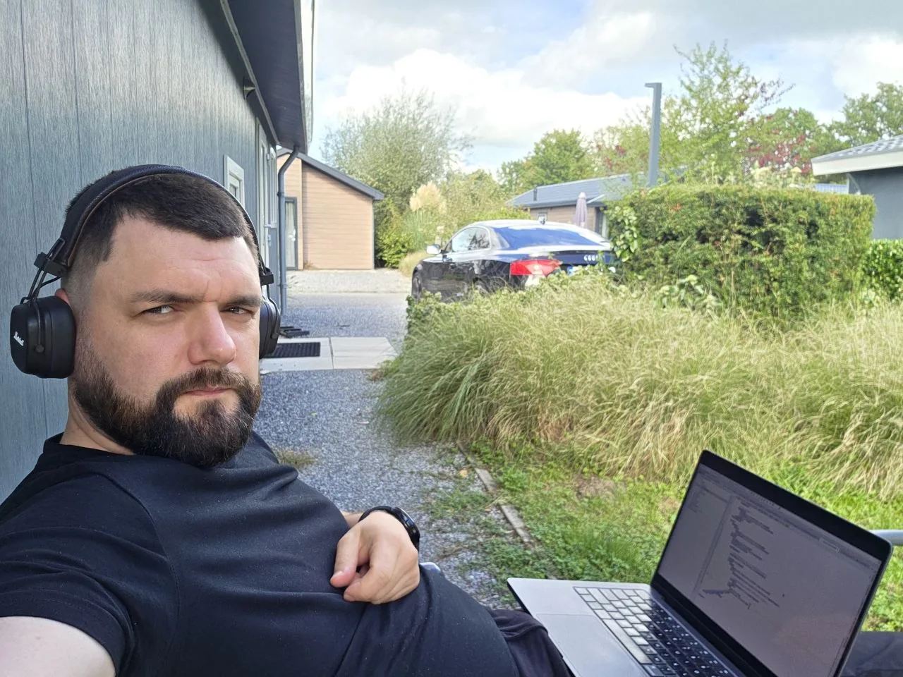 Sergiy Shram working outdoors with his laptop